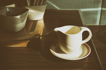 The coffee cup with the morning light in retro scene