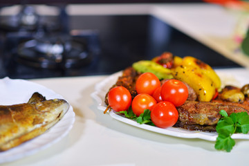 Tasty baked fish on plate on table close-up