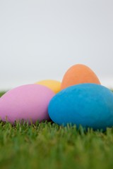 Painted Easter eggs arranged on grass