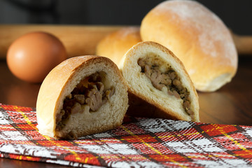 Meat pies on wooden background
