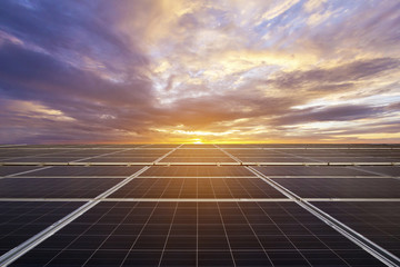 Blue photovoltaic solar panels on rooftop at twilight ,Clean energy.