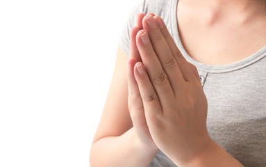 Closeup woman hand praying on white background