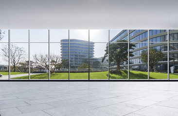 Obraz premium The modern office buildings from glass window