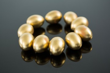 Golden Easter eggs on black background