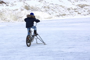 Children ride on ice. C