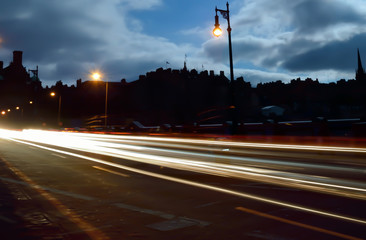 Fototapeta na wymiar Long exposure, traffic in night running through road