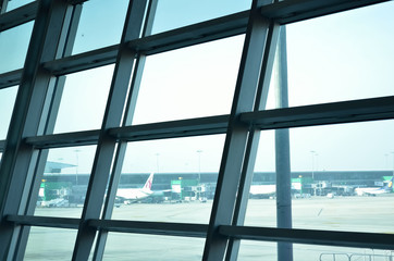 Airplane in an airport runway.