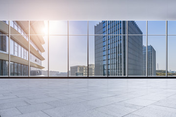 Obraz na płótnie Canvas The modern office buildings from glass window