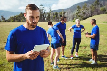 Man using digital tablet in boot camp