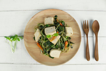 fried sunflower sprout with sauce and tofu, thai style