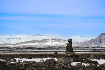 Stone stacked balanced with winter landscape backgrounds