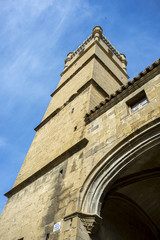 Fototapeta premium Bell tower of the San Martin de Tours Church, in Uncastillo, Zaragoza, Aragon, eastern Spain. It was consecrated around 1.179 and reformed in the XVI century