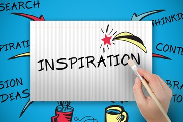 Composite image of hand holding paintbrush