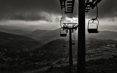 Silhouette of the lift against the backdrop of the mountains