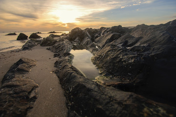Rocky sunrise at Samila beach, Songkhla, southern of Thailand