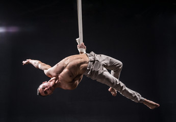 circus artist on the aerial straps man © Hladchenko Viktor
