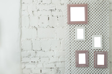Picture photo frames on a white brick wall
