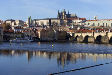 View on the autumn Prague gothic Castle with the Charles Bridge, Czech Republic