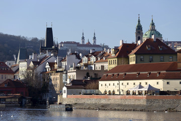 View on the autumn Prague St. Nicholas' Cathedral above River Vltava, Czech Republic