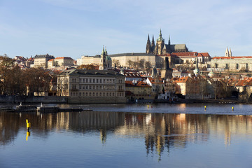 Fototapeta na wymiar View on the colorful autumn Prague gothic Castle above River Vltava, Czech Republic
