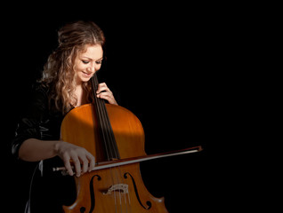 Musician play cello on dark © Andrey Burmakin