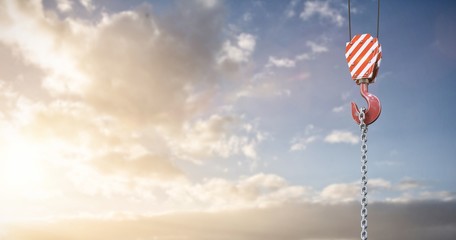 Composite image of studio shoot of a crane lifting hook