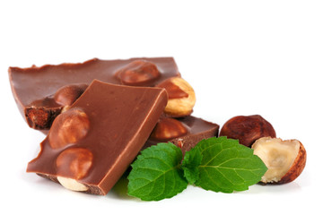 Chocolate with hazelnut and mint leaf isolated on white background
