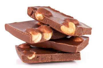 Chocolate with hazelnuts isolated on white background
