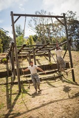 Fototapeta na wymiar Military soldiers training rope climbing