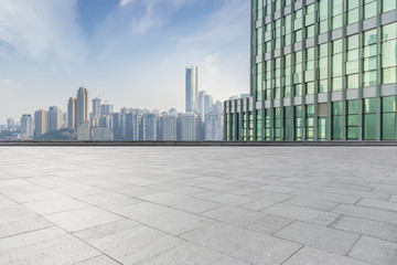 Fototapeta na wymiar cityscape and skyline of chongqing in cloud sky on view from empty floor