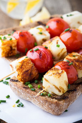 Open grilled  haloumi kebab sandwich with tomato