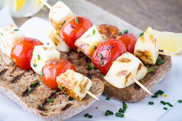 Open grilled  haloumi kebab sandwich with tomato