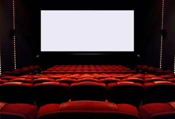 Empty cinema seats with blank white screen
