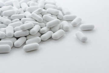 pills on white background.