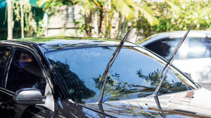 Man washing the black car.