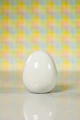 Easter theme. Eggs with tulips on wooden board, easter holiday concept. Copyspace for text.