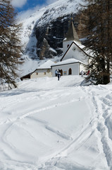 Fototapeta na wymiar Sasso della Croce - Ospizio Santa Croce - Chiesa Santa Croce under Sasso della Croce Group in the Italian Dolomites, Trentino, Italy