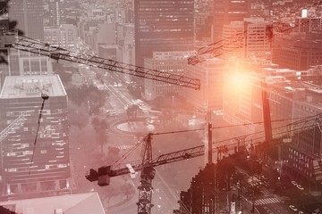 Composite image of crane and building construction site