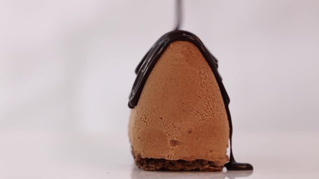 Dripping topping chocolate on a cake III
