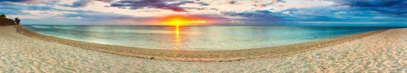 Fototapeta na wymiar Sandy beach at sunset. Panorama