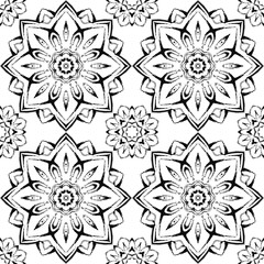 Seamless pattern with beautiful mandalas in black and white colors. Vector ornaments in grunge style