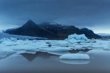 Jokulsarlon glacier lagoon, fantastic sunset on the black beach, Iceland