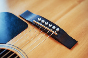 Fototapeta premium detail of classic guitar with shallow depth of field