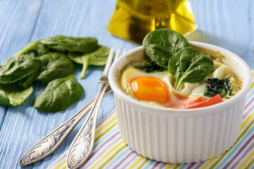 Fit food- eggs baked with spinach and tomatoes.
