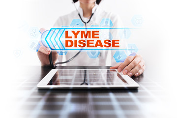 Medical doctor using tablet PC with lyme disease medical concept.