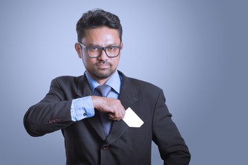 businessman putting credit card to the pocket