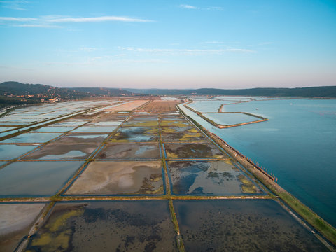 Soline in Slovenia at sunset, place of extraction of sea salt, aerial panoramic photo. Secovljske Soline.