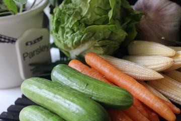 fresh vegetables and herbs, oregano, sage, chive, parsley, dill, onion, cucumber, green vegetables,  red vegetables, red pepper, pepper, garlic, cucumber, sweet corn, 