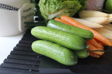 fresh vegetables and herbs, oregano, sage, chive, parsley, dill, onion, cucumber, green vegetables,  red vegetables, red pepper, pepper, garlic, cucumber, sweet corn, 