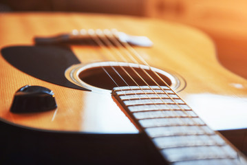 Fototapeta premium Photography classical guitar on a light brown background